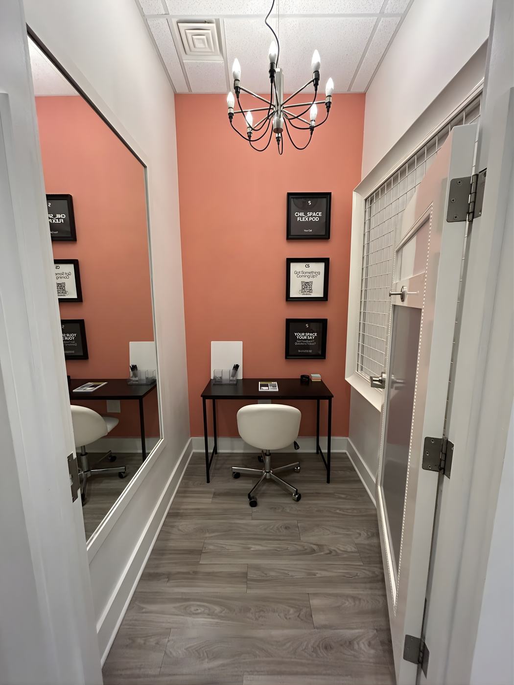 A Flex Pod with framed signage on a coral wall